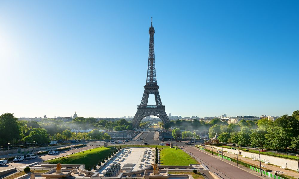 Eiffel Tower in Paris on a clear day, view from Trocadéro Gardens, showcasing one of the top tourist attractions in France.