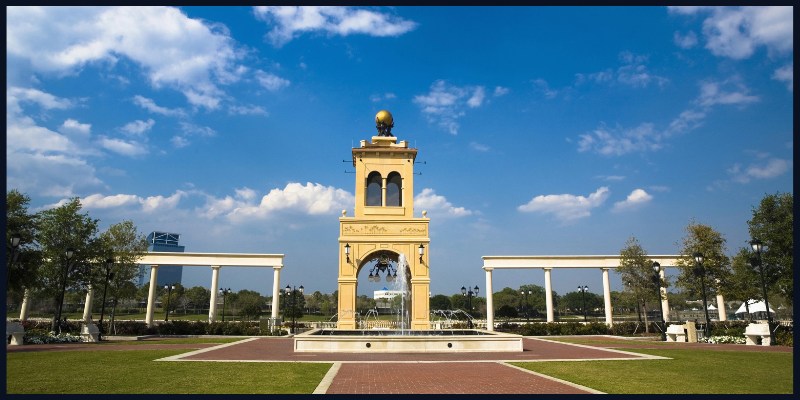 A scenic view of the iconic structure and surrounding green space in Altamonte Springs, Florida, under a clear blue sky.