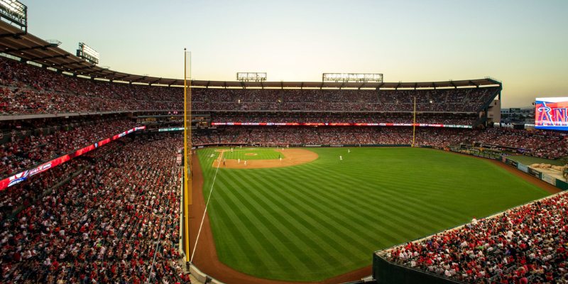 Angel Stadium is packed with fans, creating an energetic atmosphere during a thrilling baseball match.