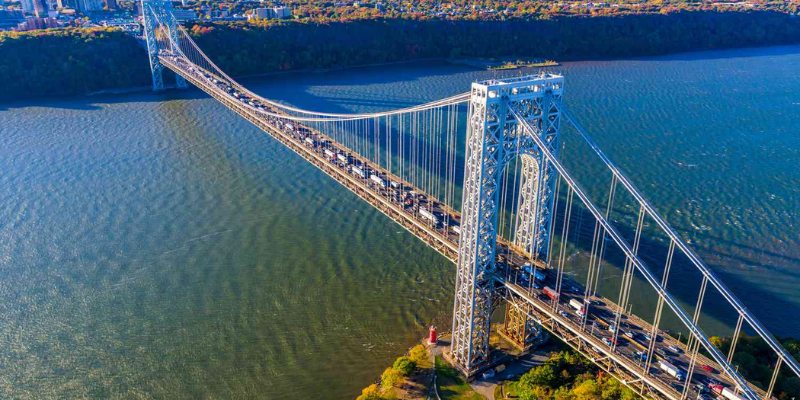 A view of the Verrazzano Bridge in New York City, showcasing its impressive structure and the George Washington Bridge nearby.