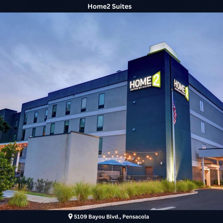 A welcoming exterior of Home2 Suites by Hilton in Jacksonville Beach, showcasing modern architecture and inviting atmosphere.