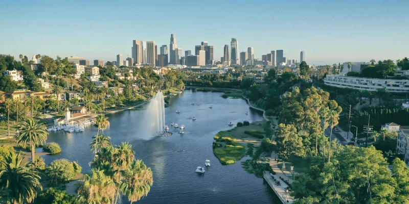 Stunning view of the Los Angeles skyline from the west, showcasing iconic buildings against a clear sky.