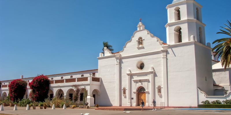 A charming white church adorned with a steeple, embodying tranquility and religious devotion in its architectural design.