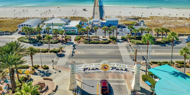 A beautiful panorama of Panama City, Florida's beach and pier, highlighting the serene coastline and inviting waters.