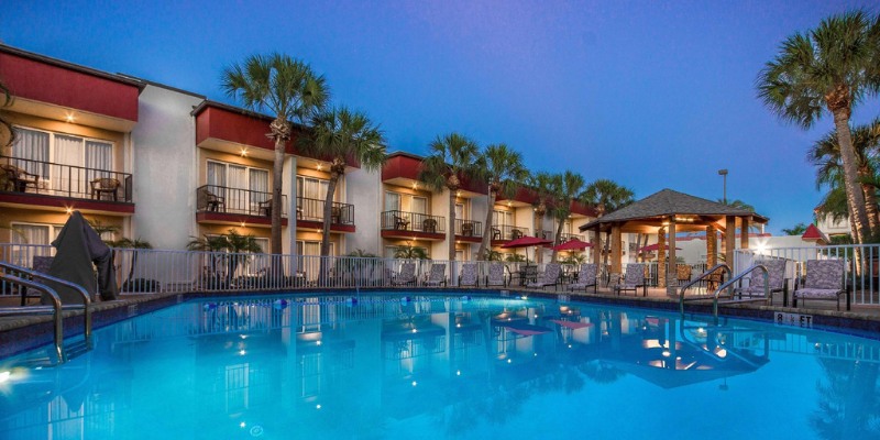 The inviting pool area at the Rodeway Inn Clearwater Central, features clear water and comfortable seating for relaxation.