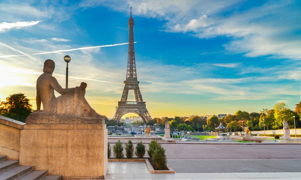 A stunning view of the Eiffel Tower in Paris, France, showcasing its iconic structure against a clear blue sky.