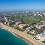 Stunning aerial shot of West Palm Beach, highlighting the beautiful beach and the expansive ocean in Miami.