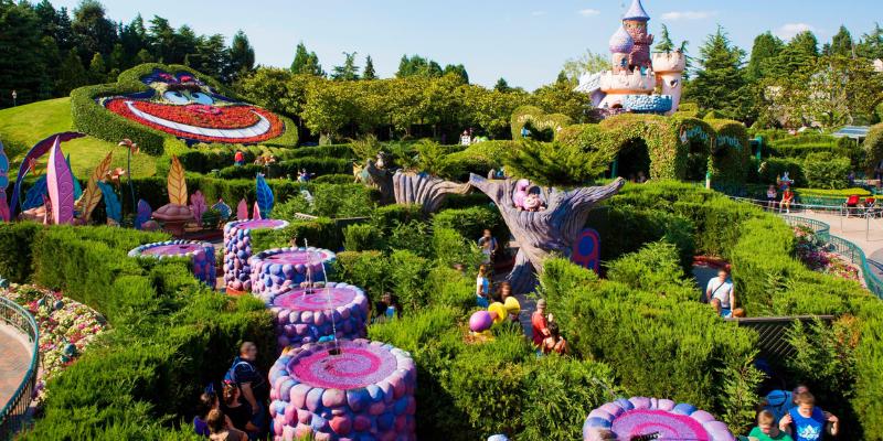 Themed maze at Disneyland Paris, showcasing whimsical sections based on Alice's adventures in Wonderland.