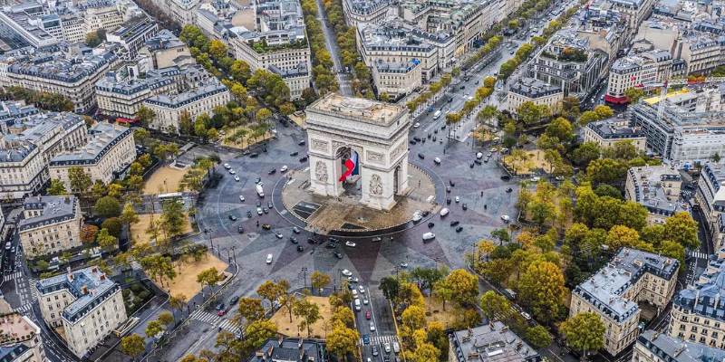 A view of the Arc de Triomphe in Paris, France, showcasing its grand architecture and historical importance.