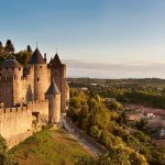 Carcassonne's iconic castle rises above the town, blending history and beauty in a picturesque landscape.