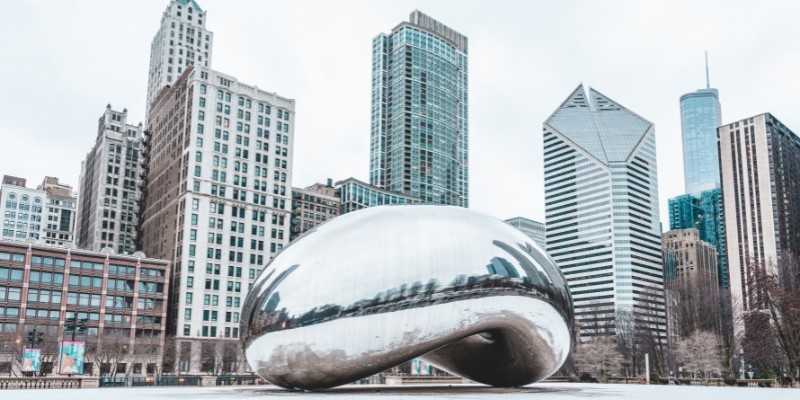 Chicago's iconic bean sculpture gleams under the sun, attracting tourists year-round, especially in spring and summer.