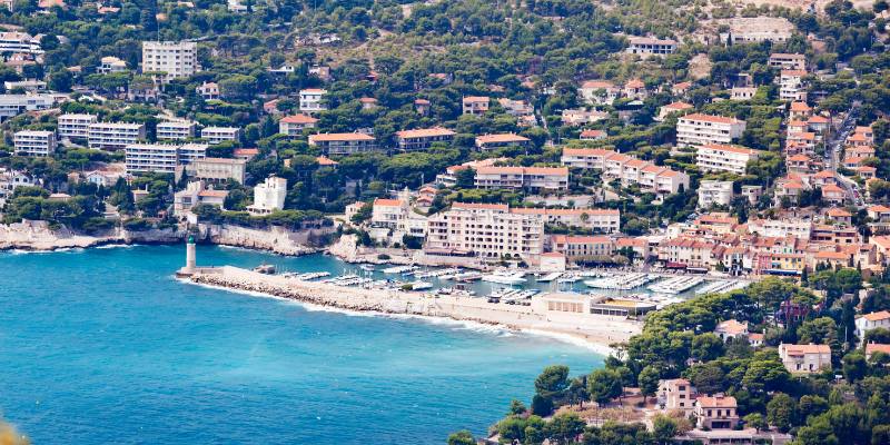 Overlooking the sea from a hill in Cassis, the image captures the breathtaking blend of land and water.