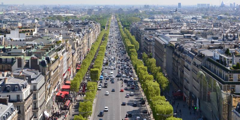 A lively scene on Champs-Élysées, Paris, highlighting the iconic fashion street atmosphere.