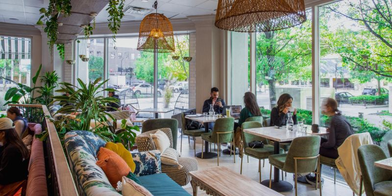 Lively Chicago coffee shop interior, filled with people at tables, creating a welcoming dining atmosphere.