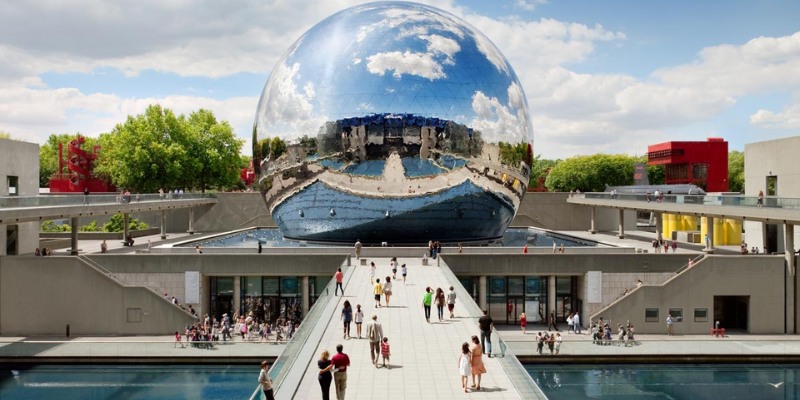 In the heart of the Cité des Sciences et de l'Industrie, a large mirror ball captivates with its reflective brilliance.