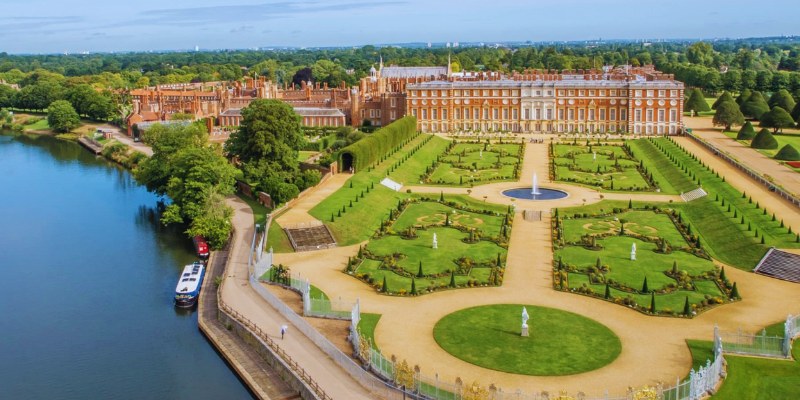 Hampton Court Palace in England, showcasing its historic architecture and beautiful gardens.