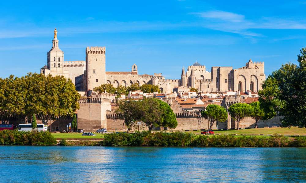 The Palace of Popes, a historic landmark, dominates the skyline with its grand architecture and cultural heritage.