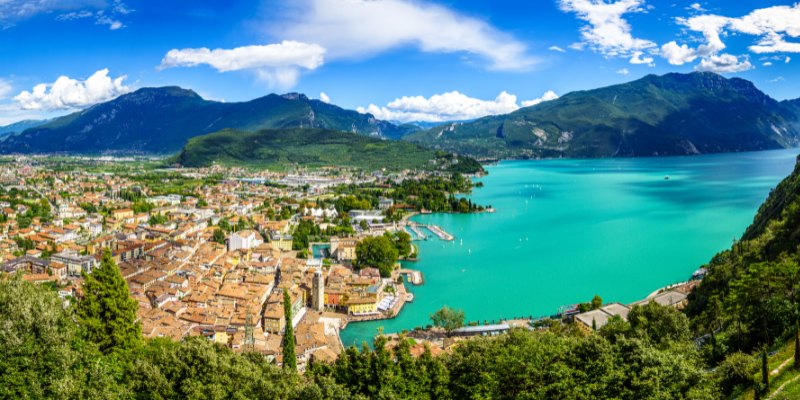 Scenic Lake Garda is framed by the charming city of Lombardia, showcasing Italy's natural beauty and urban elegance.