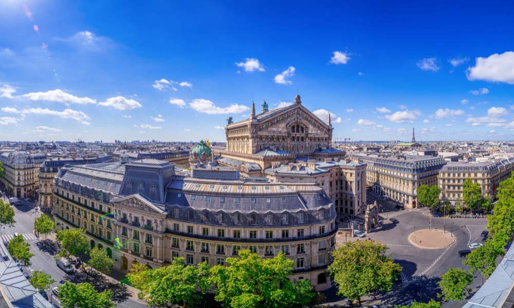 The stunning skyline of Paris, France, captured from the rooftop of a building, featuring famous landmarks and architecture.