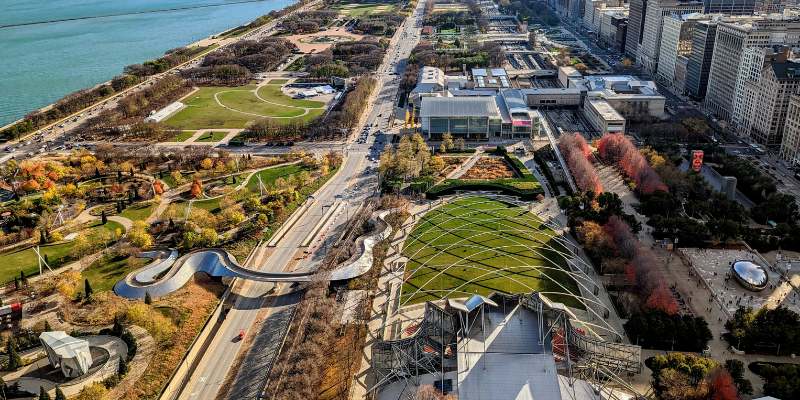 Bird's-eye view of Chicago with Millennium Park at the center of the bustling city.