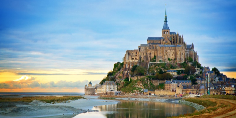 Mont Saint Michel, a picturesque island in France, featuring its historic abbey and dramatic tidal landscape.