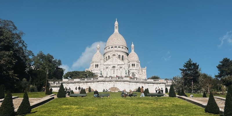 The Basilica of Sacré-Cœur, located in Montmartre, Paris, features its distinctive domes and panoramic city views.