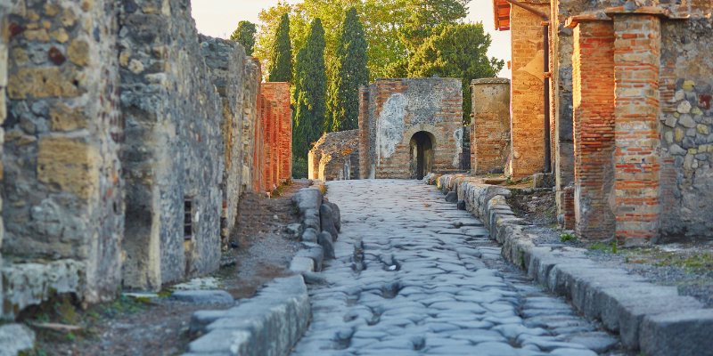 A panoramic view of the ancient city of Pompeii, showcasing its well-preserved ruins and historical significance.