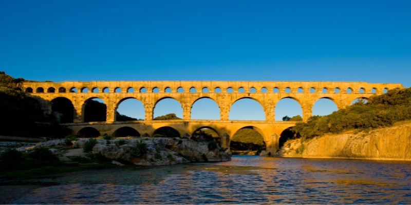 The iconic Pont du Gard, a Roman aqueduct in Provence, France, exemplifies remarkable ancient architecture and history.