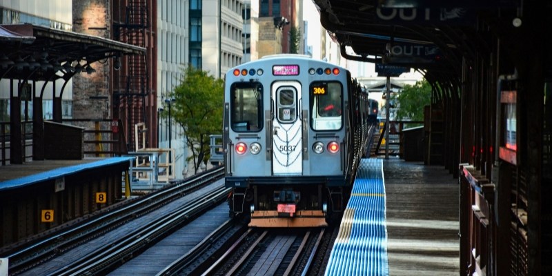 A train pulls into a station, bringing travelers to the platform for their next adventure.