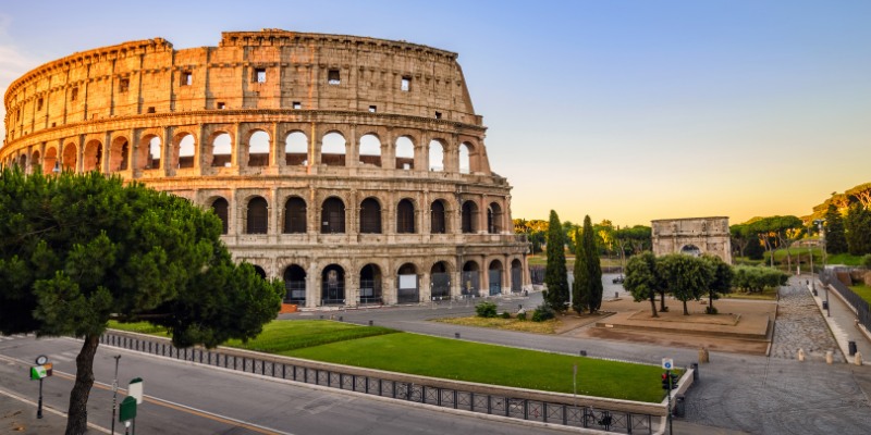 A view of the Colosseum in Rome, Italy, highlighting its grandeur and iconic structure amidst the bustling city.