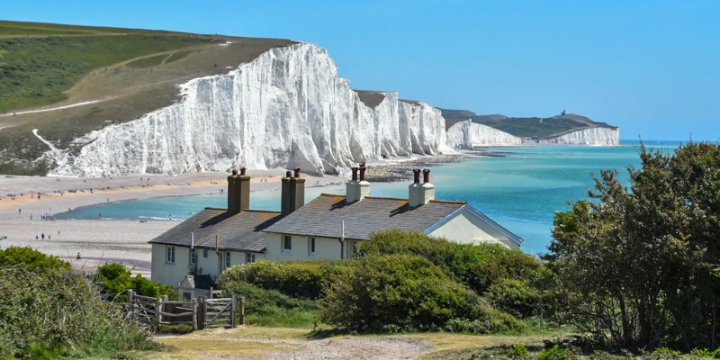 A breathtaking view of the white cliffs of Dover, featuring the majestic Seven Sisters Cliffs along the English coastline.