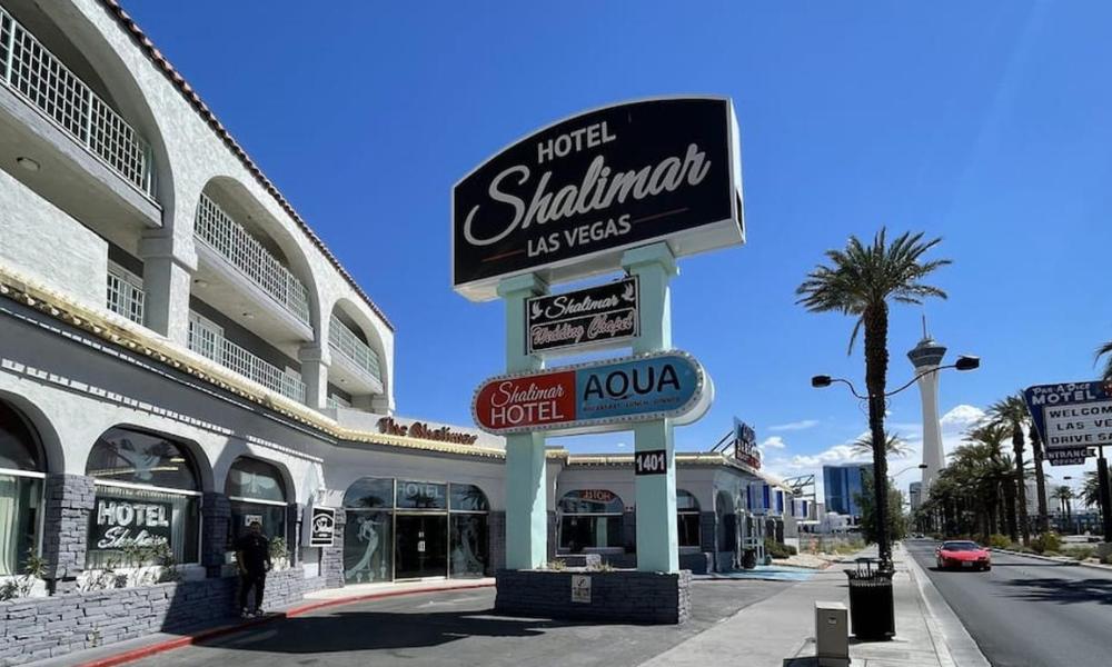 Sign for Shalimar Hotel of Las Vegas at the street corner, showcasing the hotel's name prominently.