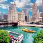 Chicago River bustling with boats, framed by the stunning city skyline.