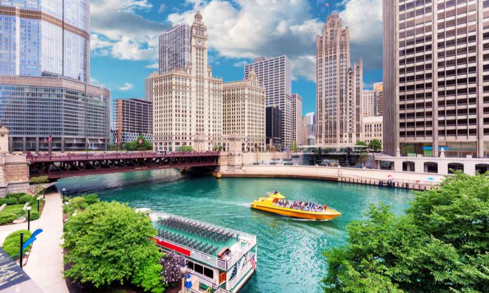 Chicago River bustling with boats, framed by the stunning city skyline.