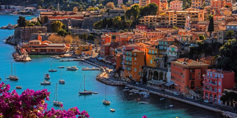 Scenic image of Villefranche-sur-Mer, highlighting the charming town of Nice, France, with its colorful architecture and serene coastline.