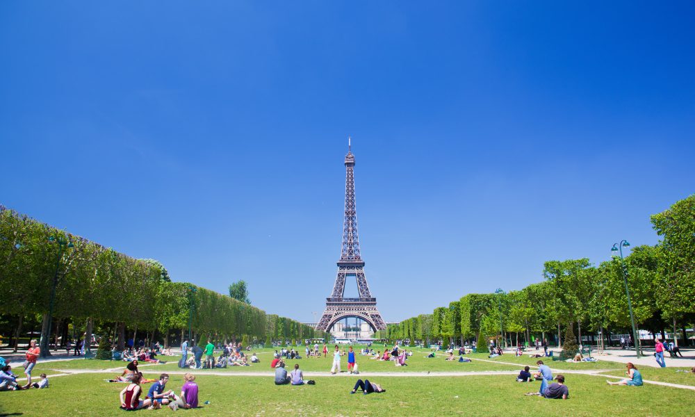 A stunning view of the Eiffel Tower in Paris, France, showcasing its iconic structure against a clear blue sky.