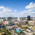 Aerial view of Miami showcasing the skyline, with West Palm Beach visible in the distance.