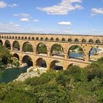 Historic Pont du Gard bridge in France, showcasing ancient Roman engineering and stunning natural surroundings.