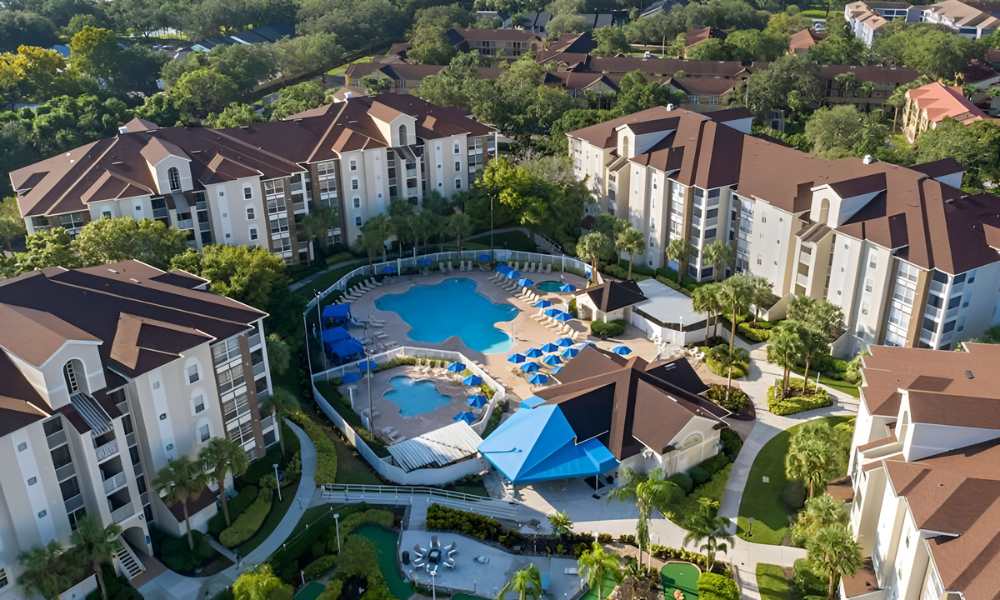 The villa is nestled near Universal Studios Orlando among trees and includes a refreshing pool, creating a peaceful retreat for visitors.