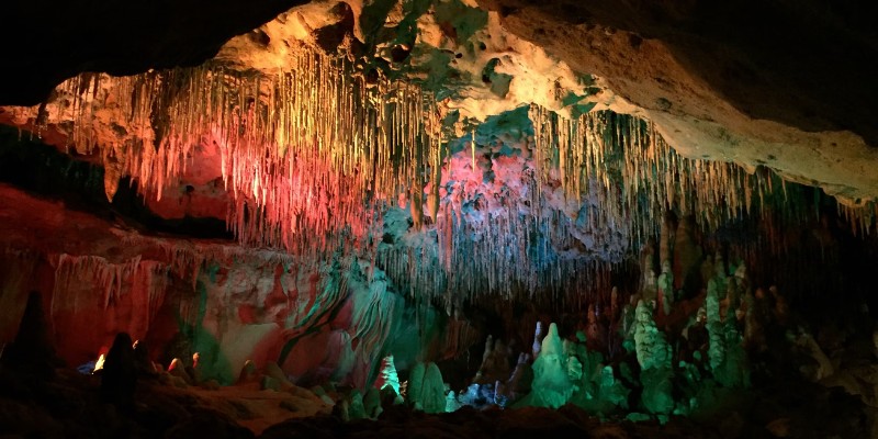 Colorful rock formations inside the cave at Florida Caverns State Park, showcasing vibrant mineral deposits and textures.