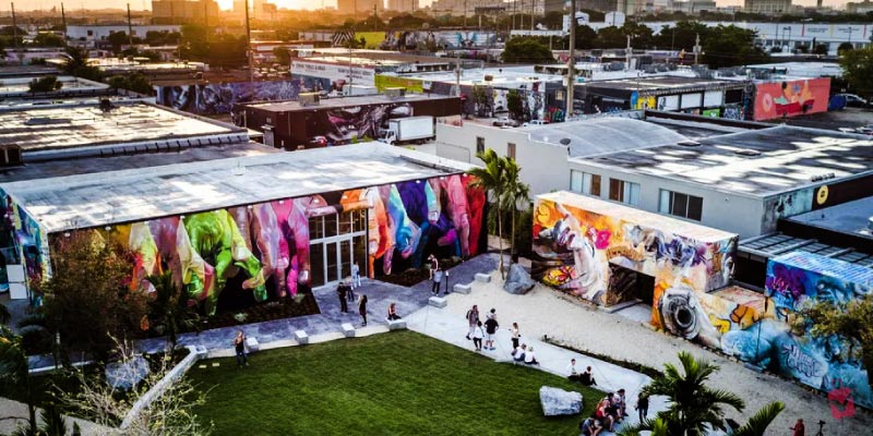 An aerial view of colorful murals and buildings at Art Basel Miami Beach.