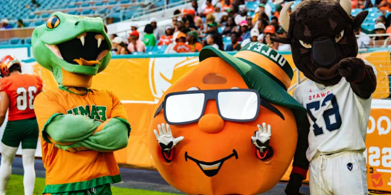 Mascots on a football field at the Orange Blossom Classic.