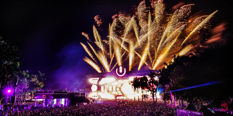 Fireworks over a large stage and crowd at the Ultra Music Festival.