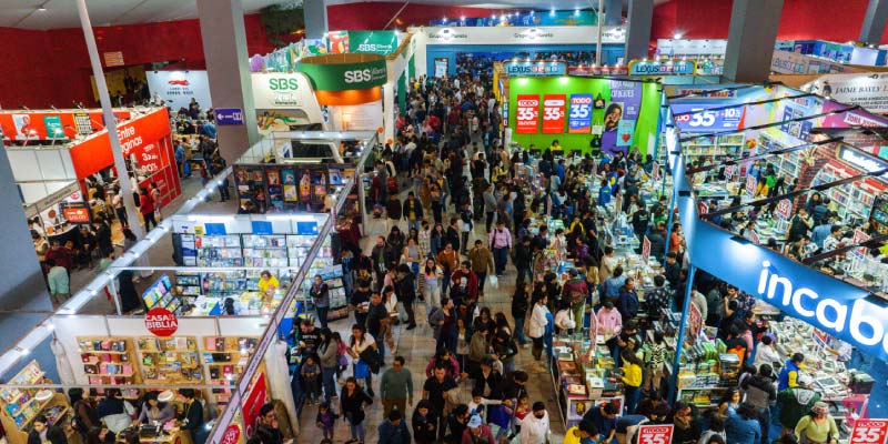 Large crowds browse through numerous book stalls inside the massive exhibition hall of the Feria Internacional del Libro (FIL) in Guadalajara.