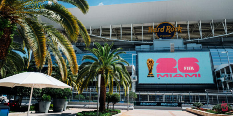 Hard Rock Stadium in Miami with a "FIFA World Cup 2026 Miami" logo displayed on a large screen.