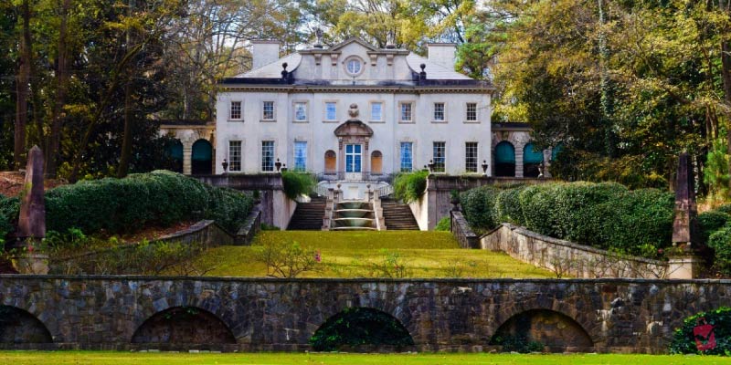 Swan House at Atlanta History Center is a grand Renaissance Revival mansion featuring a stone staircase and cascading water fountain.