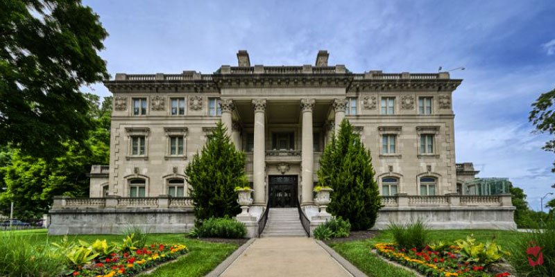 The Kansas City Museum is a stately mansion with columns, a grand entrance, and manicured gardens.