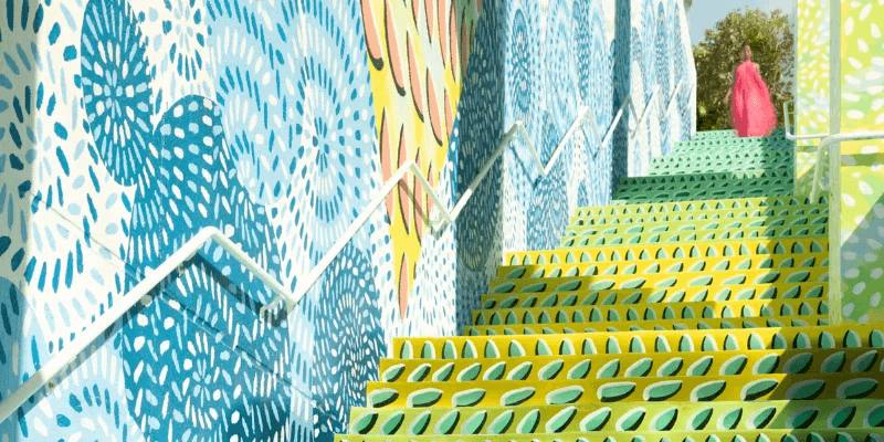 A colorful painted staircase with blue and green patterns in the Wynwood arts district.