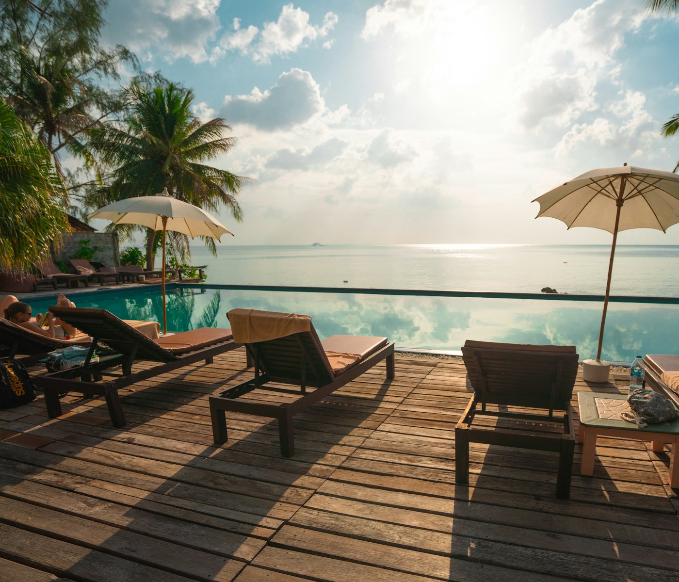 Poolside loungers and parasols at a resort